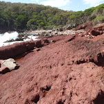 Red rock in red sands bay