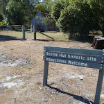 Signpost outside fence at Scotts Hut