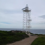 White metal tower below Green Cape Lighthouse