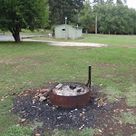 Fire pit and toilet in background