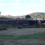 View of highway and bridge from the upper Yarrangobilly Village camping area
