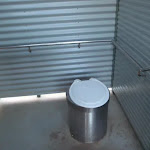 Pit toilet with hand rails
