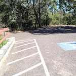 One of a few carparks next to the mud brick building