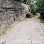 Sandstone wall and old Cobblestone Rd