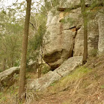 Rock cliff and cave at the base of Monkey Face cliff near Bangalow campsite in the Watagans