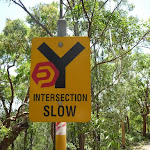 yellow sign showing 'Intersection Slow' near Murray's beach