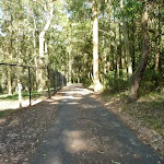 Metal ring fence beside a sealed trail in the Blackbutt Reserve
