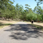 Trail with garage bin in the distance in Richley Reserve