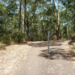 Sealed trail with metal post near Richley Reserve in Blackbutt Reserve