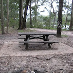 The picnic table and campfire