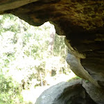 walking under a rock overhang