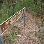 Sign into tributary of GLenbrook Creek, read top of sign