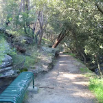 Benches and seats are common along the side of the creek
