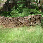 Stone wall next to track